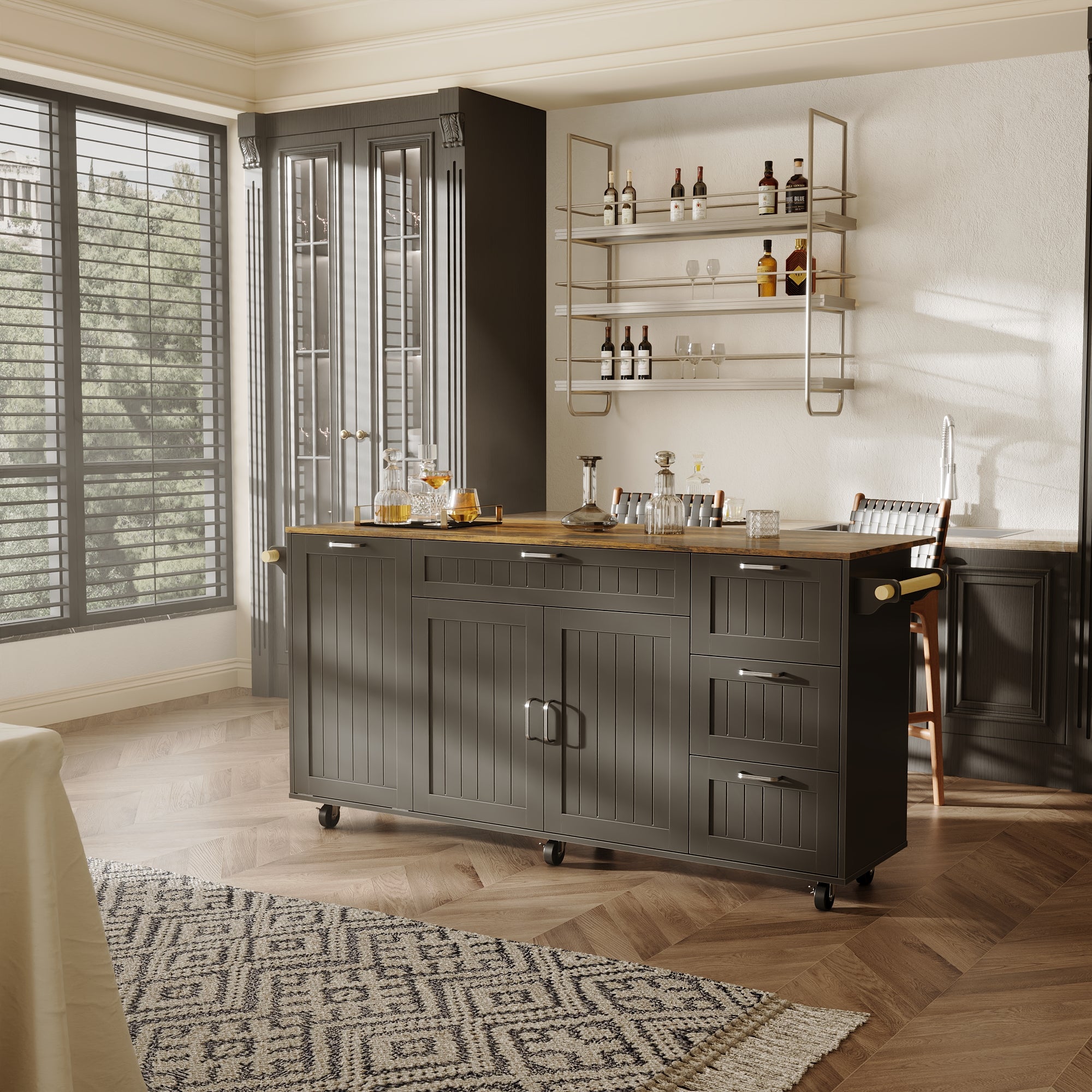 Black kitchen island with wood top, drawers, cabinet doors, towel bar, and wheels