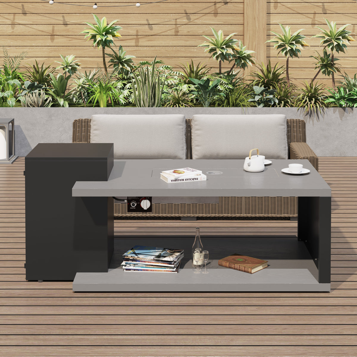 Outdoor patio set with sofa, coffee table, and small table against a wooden wall with plants.
