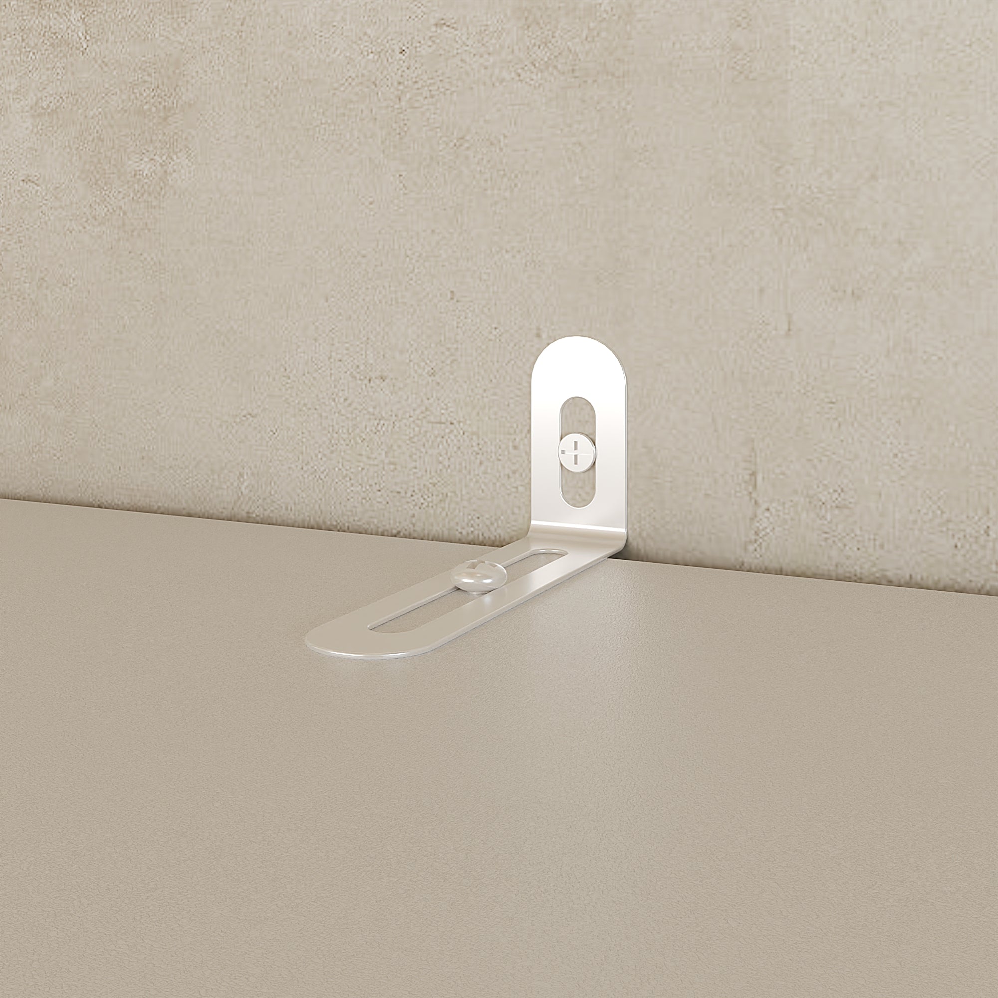 Metal bracket on a beige surface with a textured beige wall background