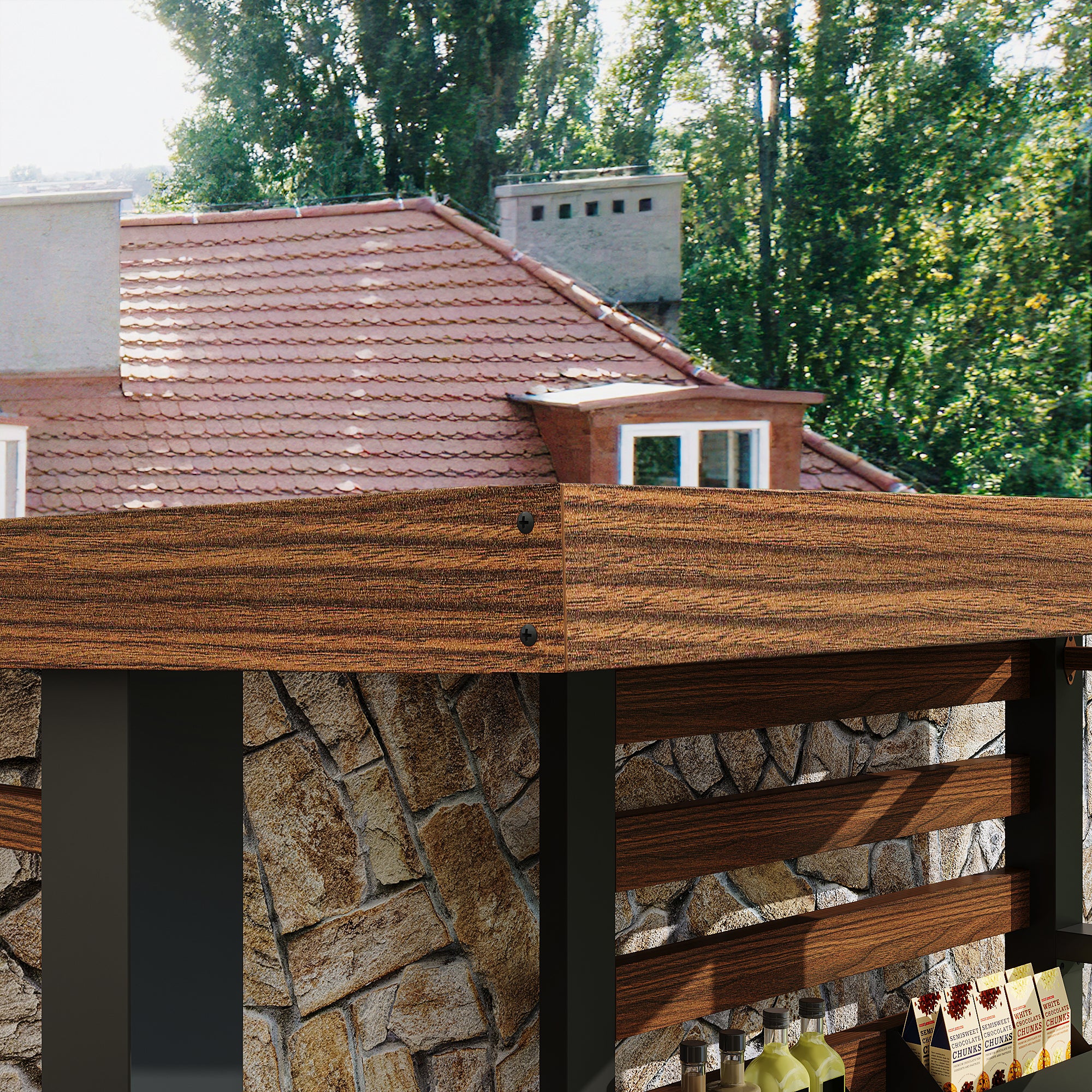 Wooden outdoor bar with stone base against a house and trees