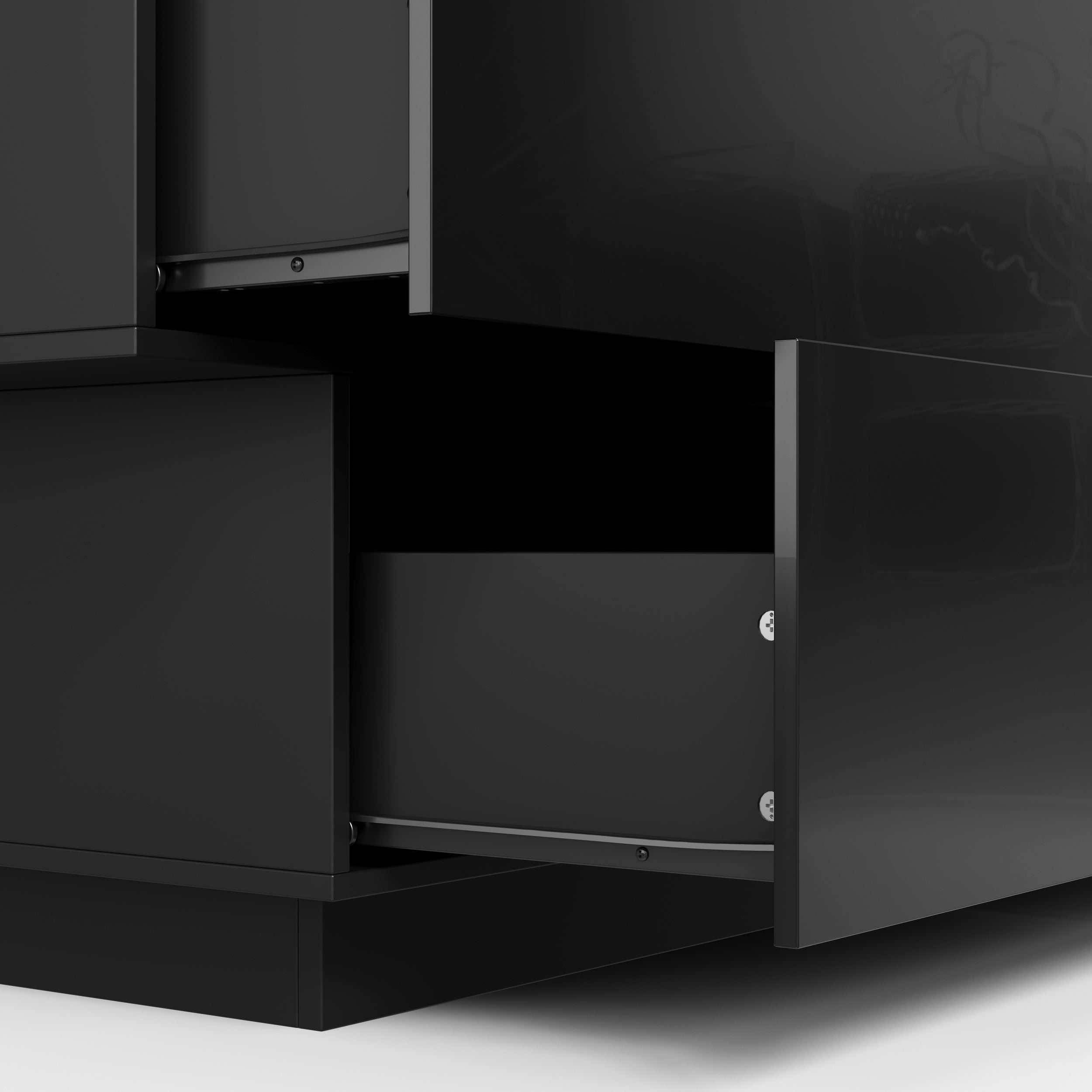 Black high-gloss dresser with wide drawers and vanity mirror setup