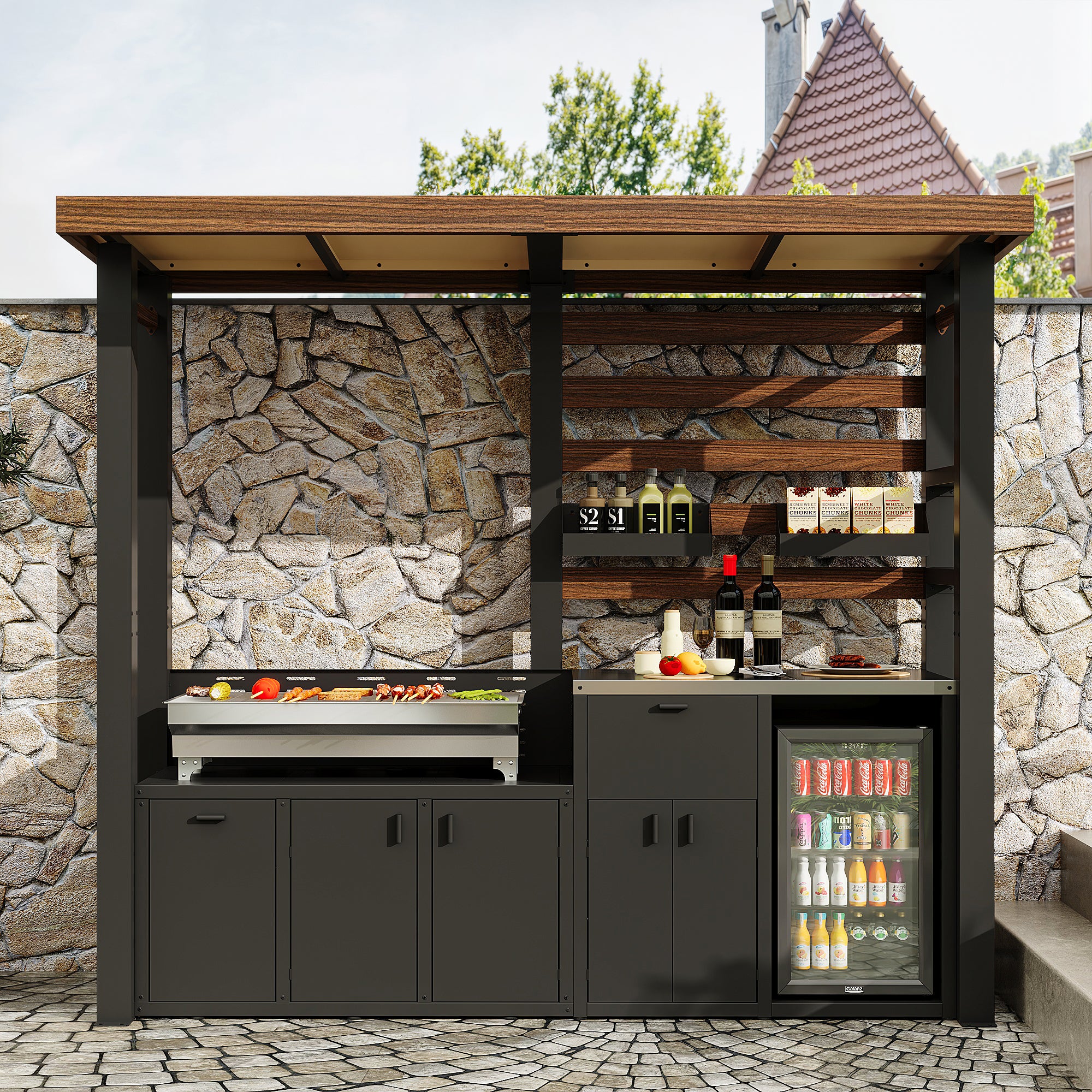 Outdoor kitchen with barbecue, shelves, and refrigerator against a stone wall.