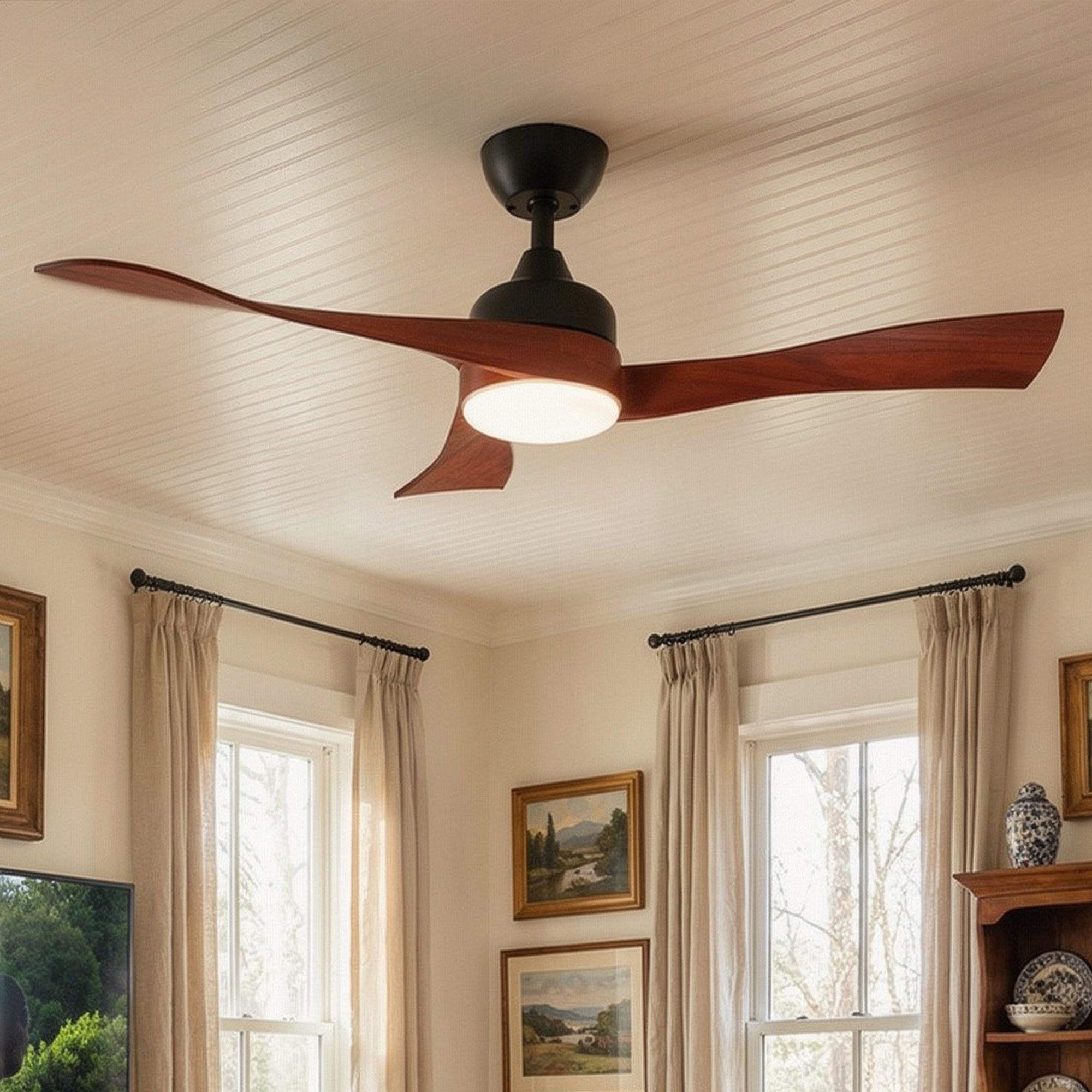 Ceiling fan with wooden blades in a room with windows and decor
