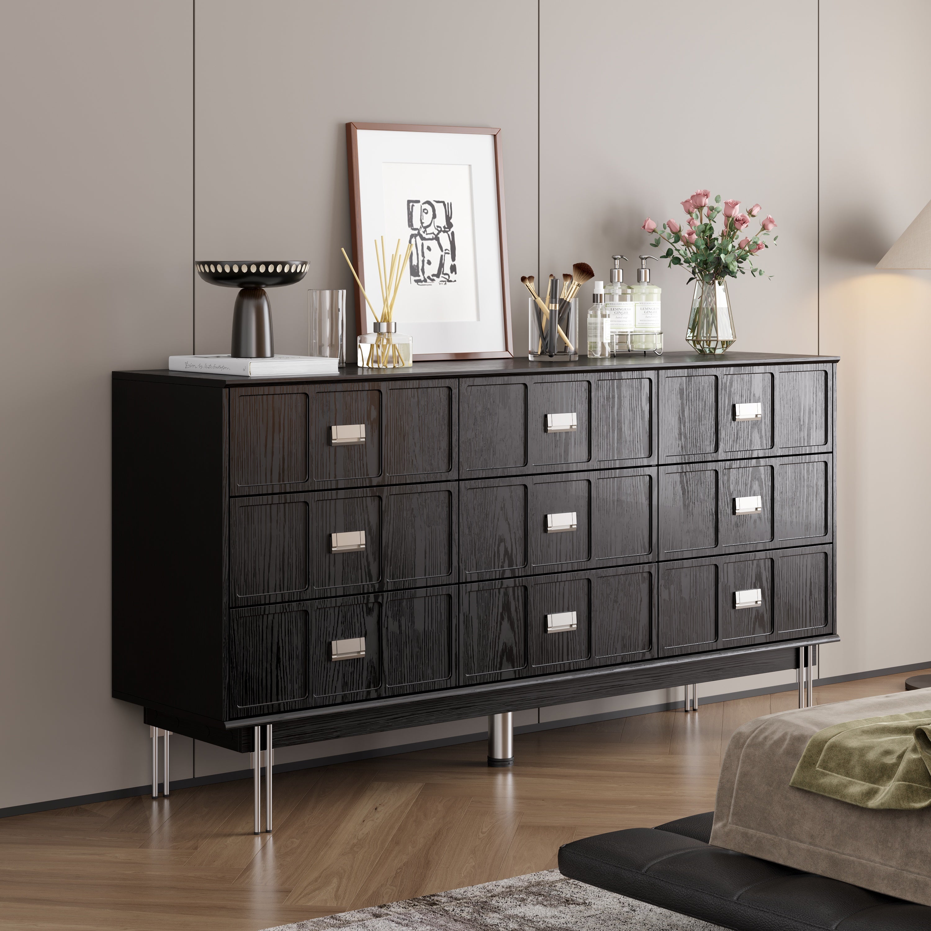 Modern black dresser with silver handles and metal legs