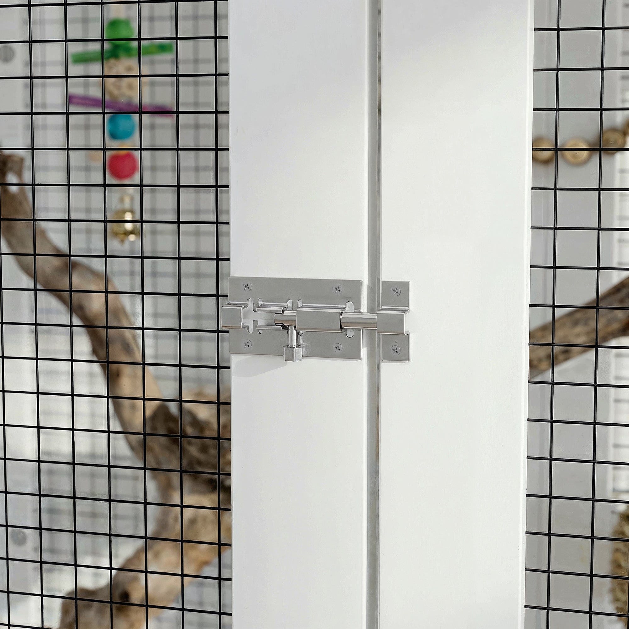 Glass shower enclosure with a handle on a tiled wall background