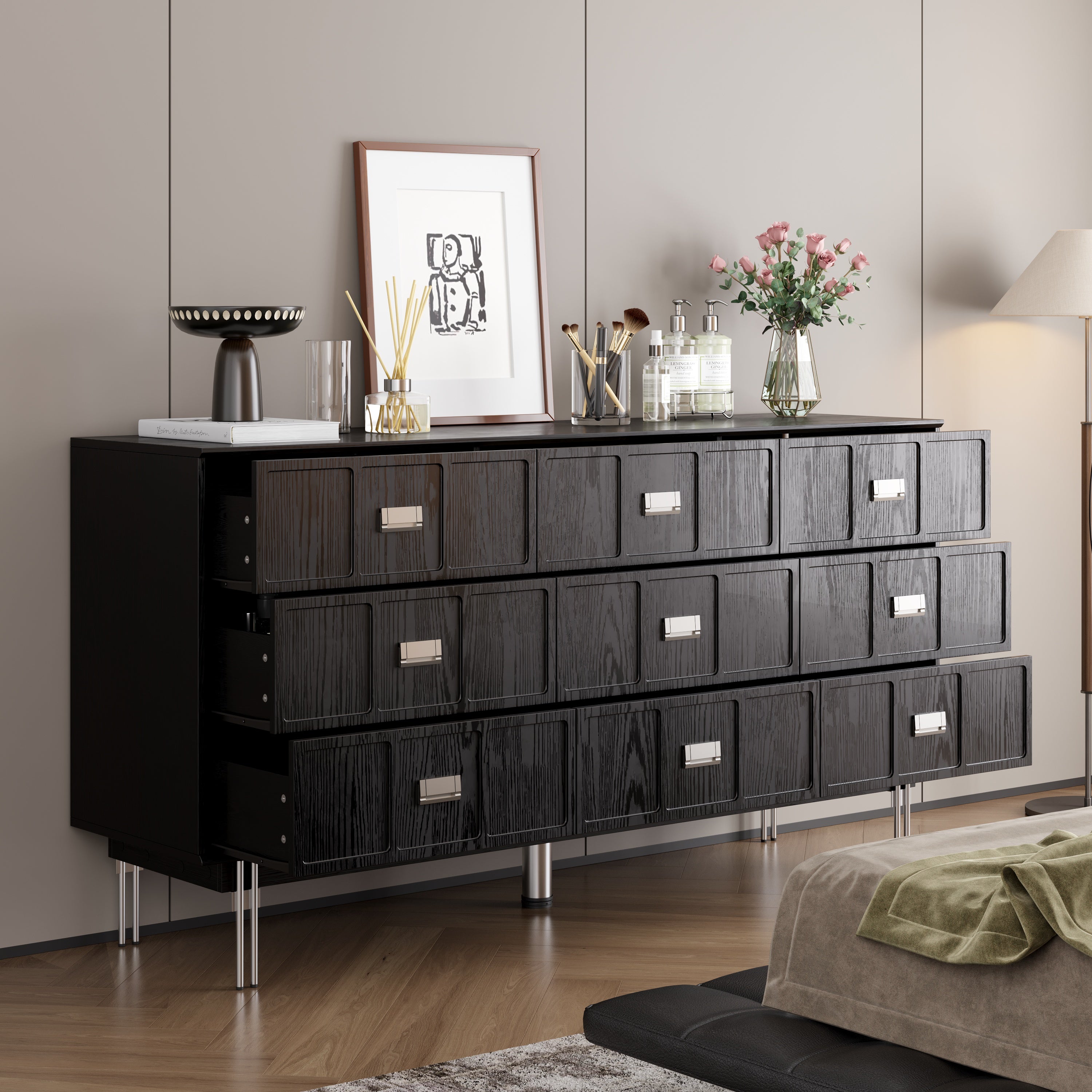 Modern black dresser with silver handles and metal legs