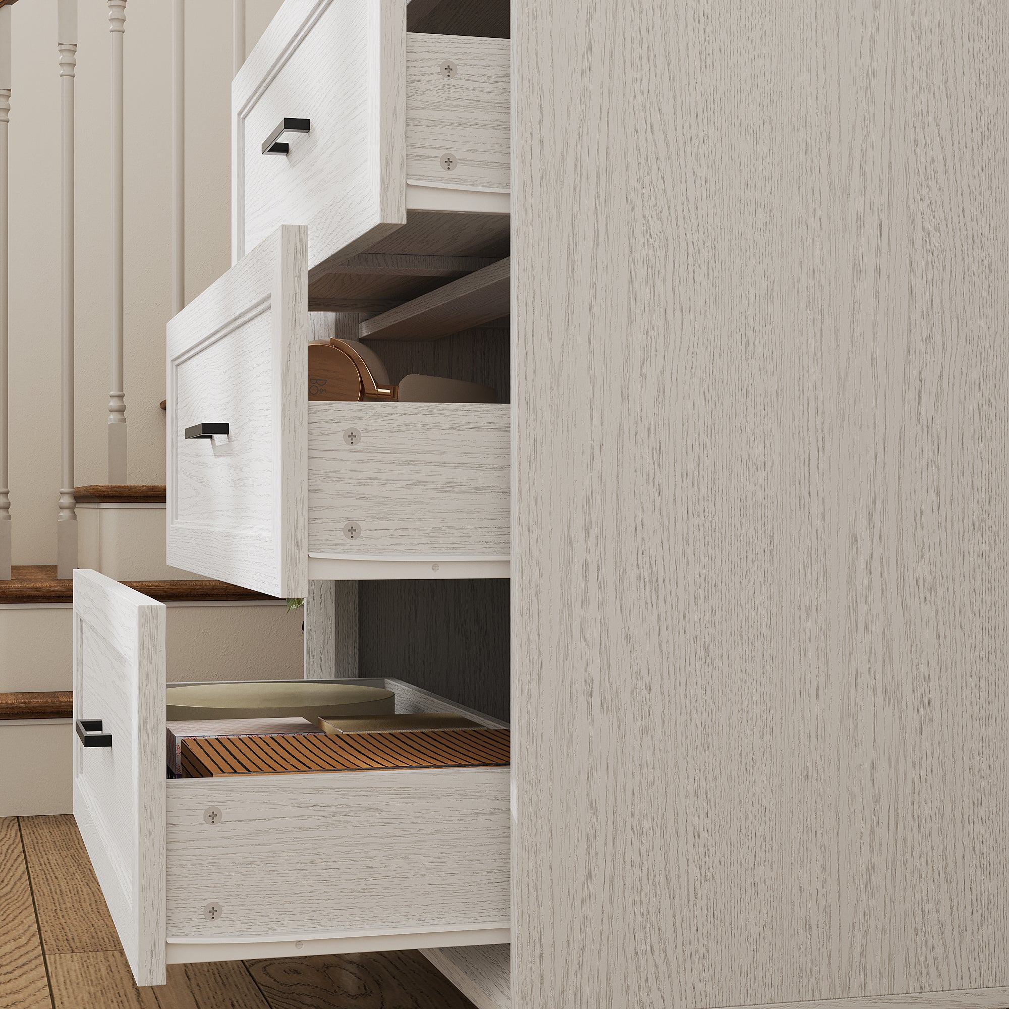 White 3-drawer nightstand with raised panel fronts and black handles