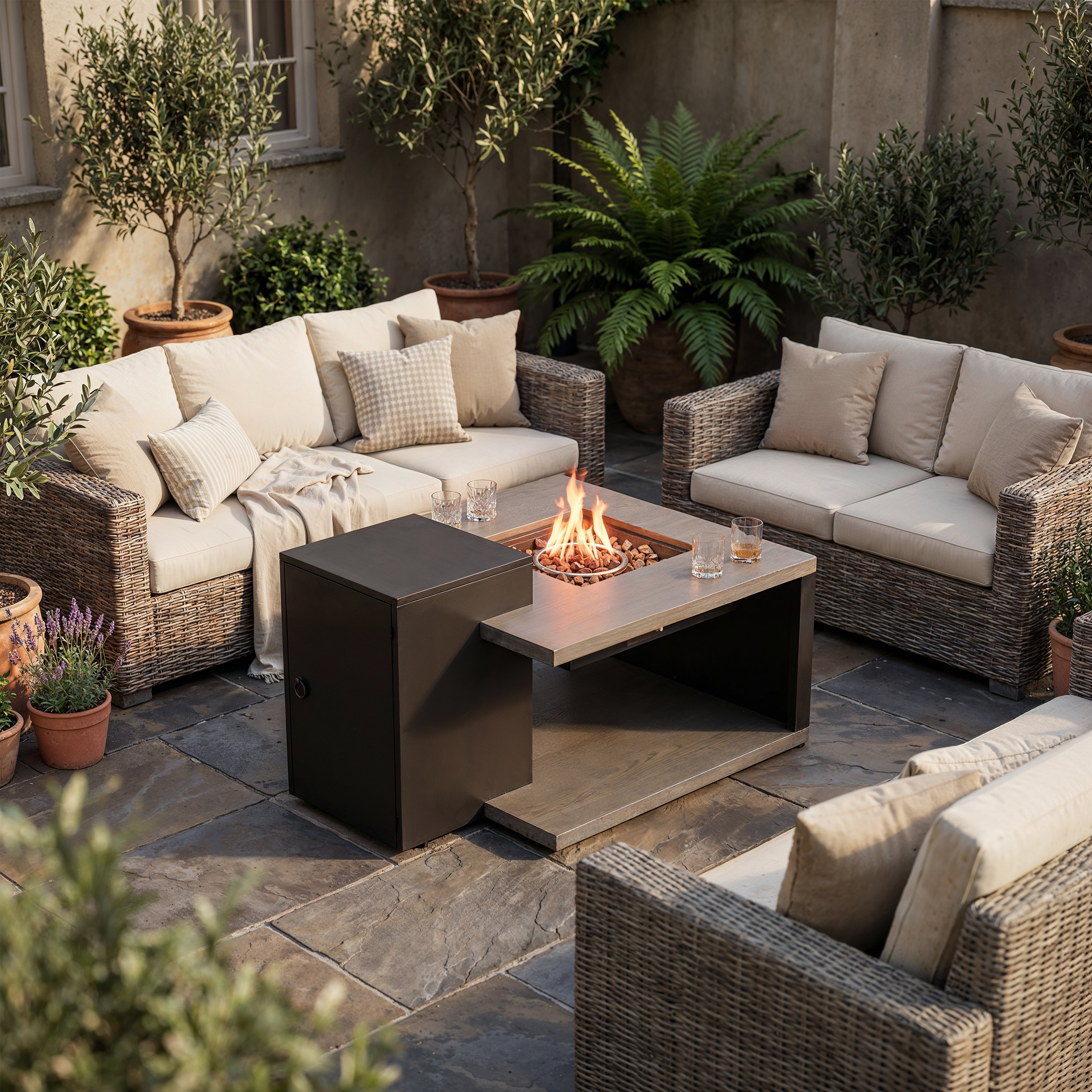 Outdoor patio with wicker furniture, fire pit, and potted plants