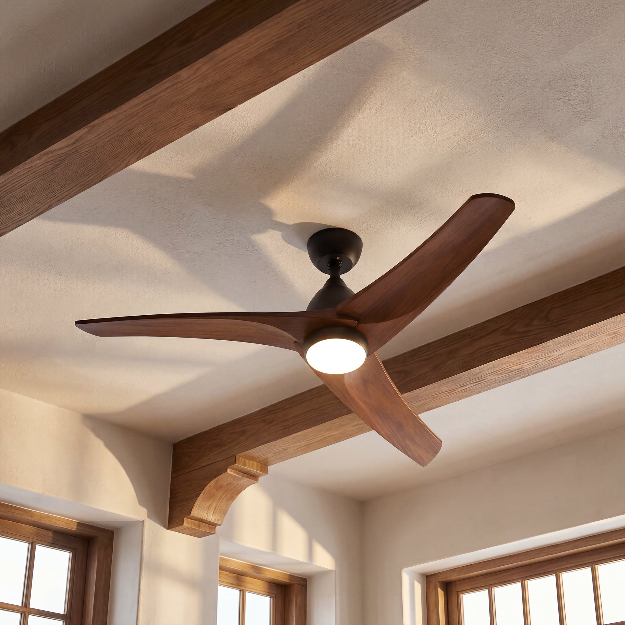 Ceiling fan with wooden blades in a room with wooden beams and windows.