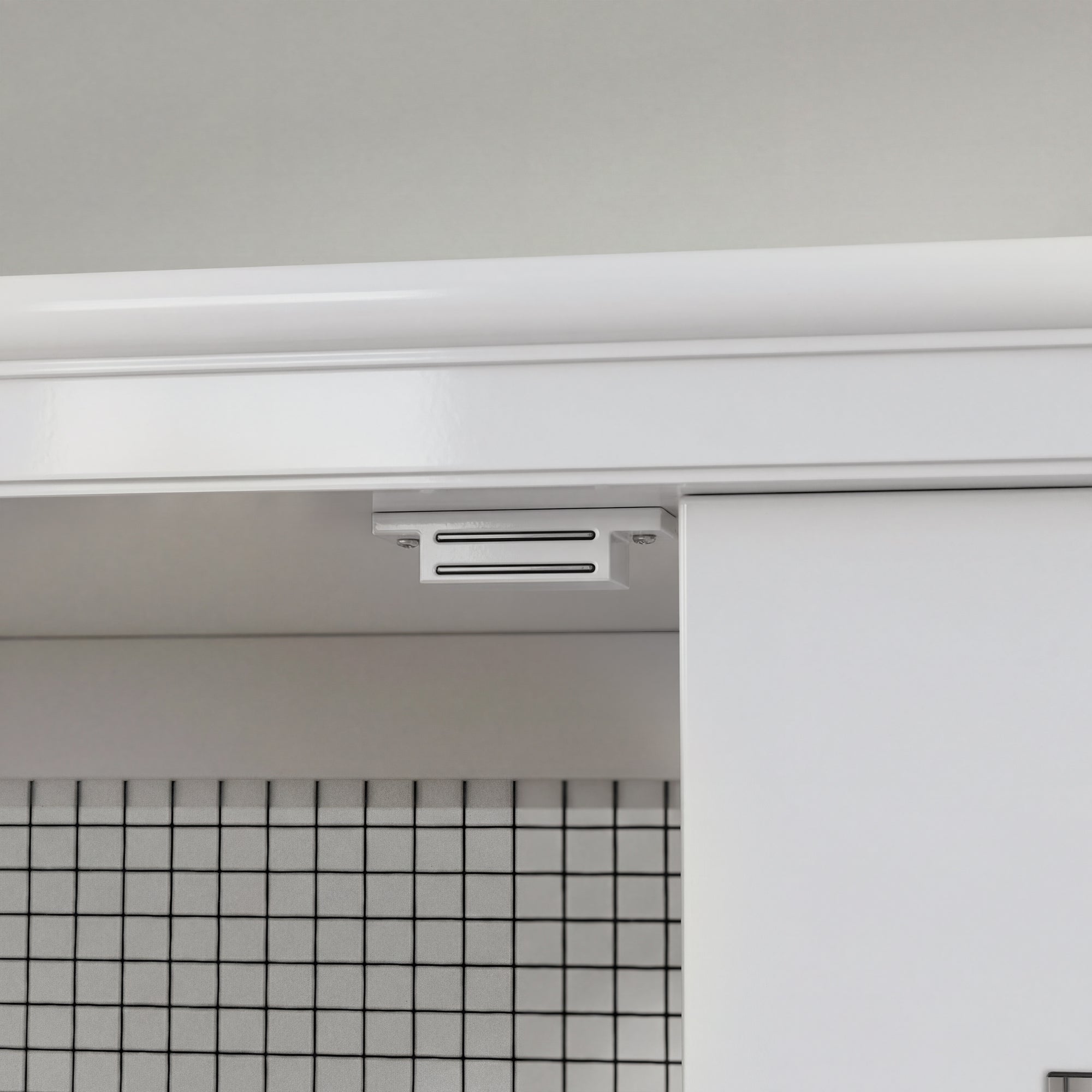 Close-up of a kitchen cabinet with a light fixture above it.