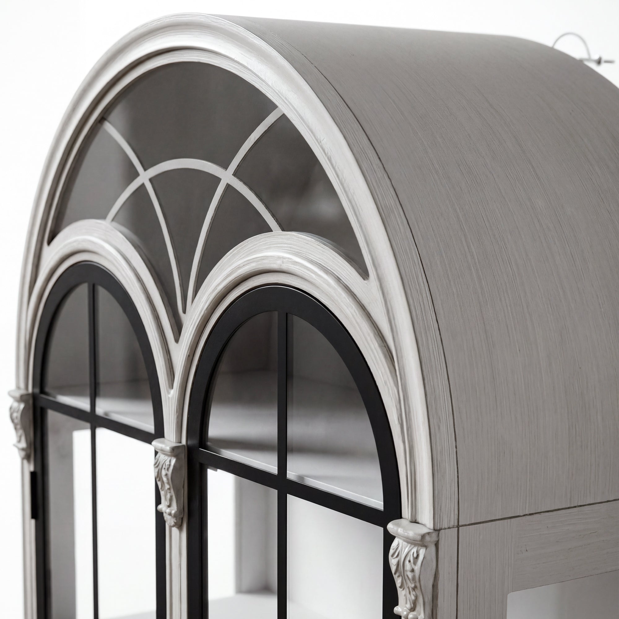 Arched display cabinet with glass doors and drawers