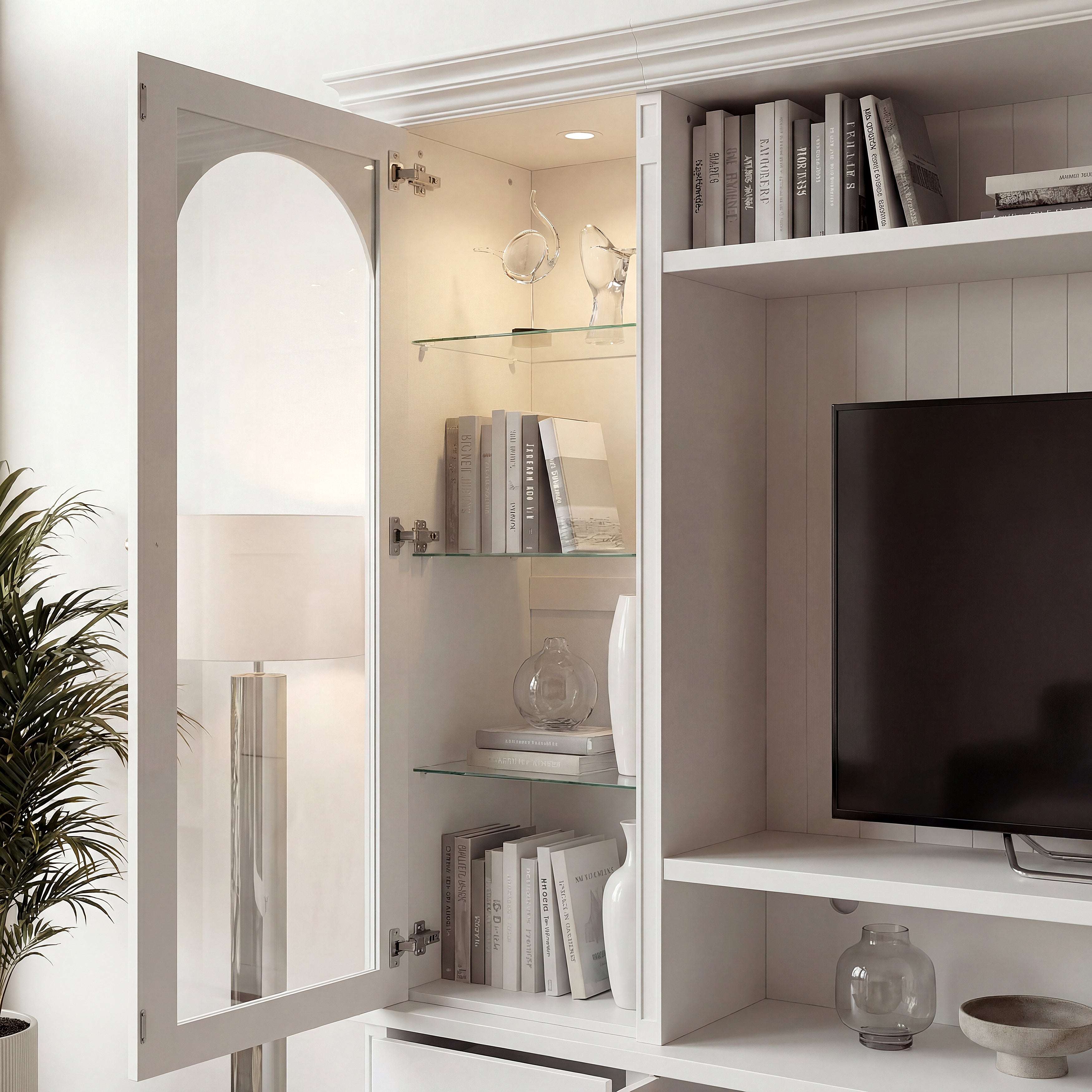 White entertainment center with open TV space, glass side cabinets, lower storage cabinets, and drawers
