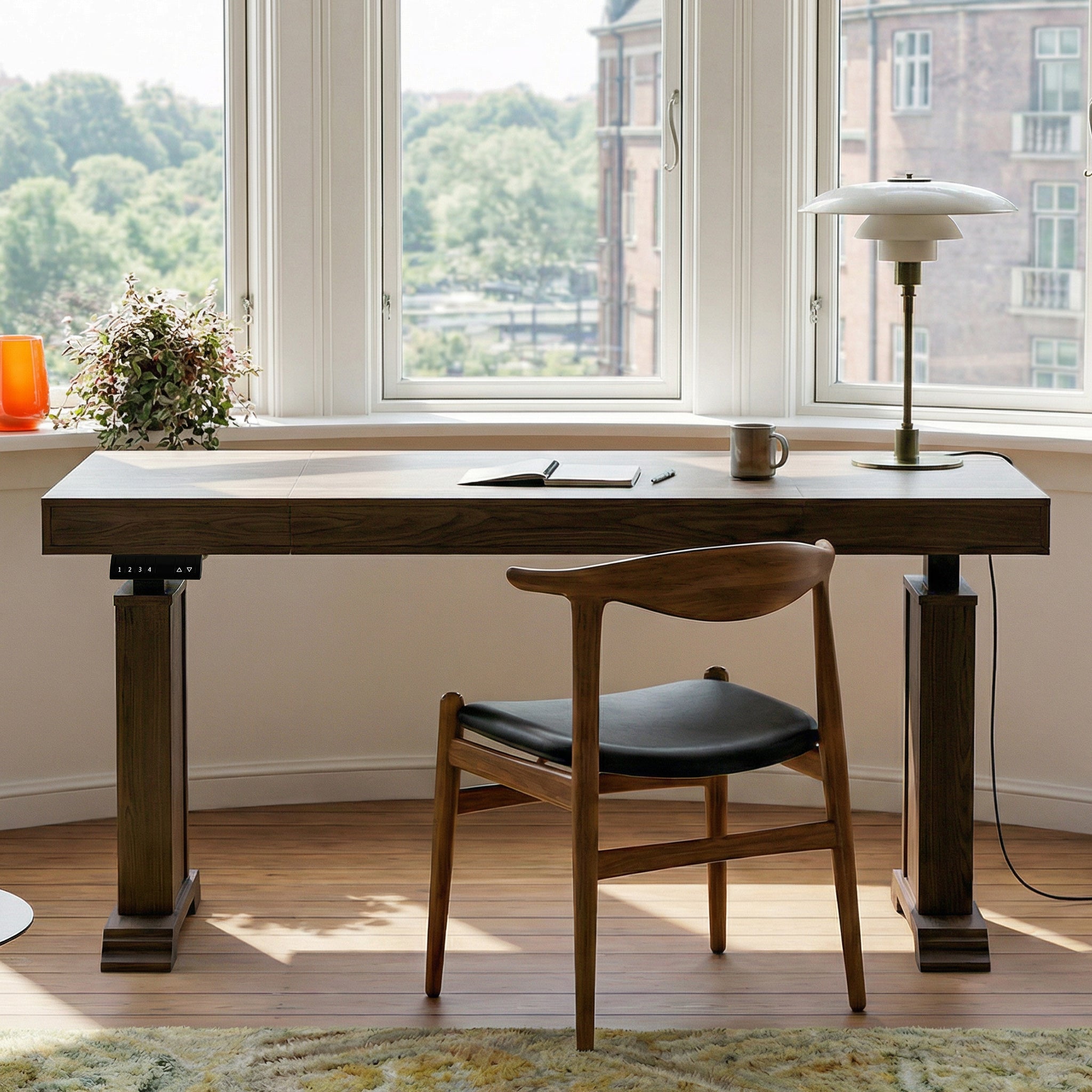 Dark wood standing desk with electric height adjustment and control panel