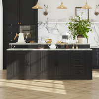 Modern kitchen with black cabinets, marble island, and decorative elements.