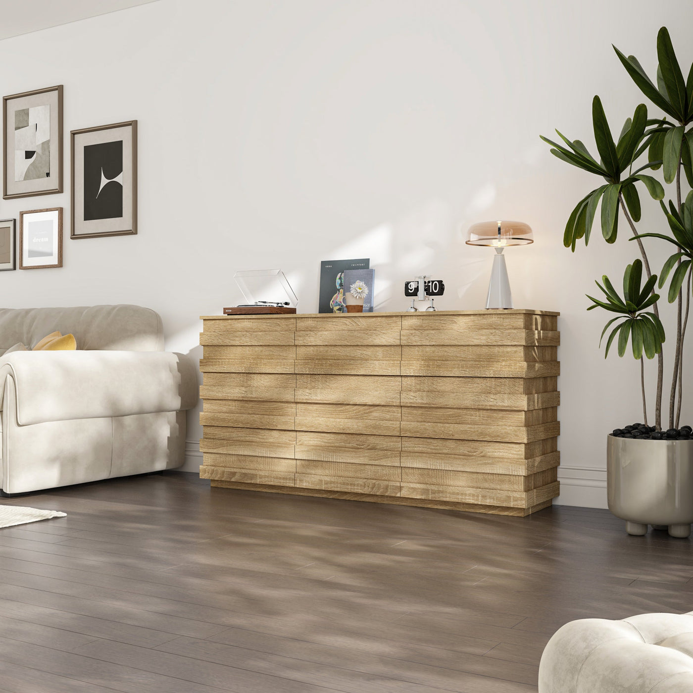 Modern living room with a wooden dresser, white sofa, and decorative items