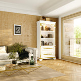 Living room with a white bookshelf, sofa, and decorative items.