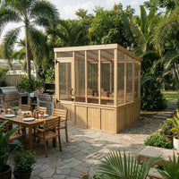 Wooden outdoor enclosure with a patio table and chairs in a garden setting.