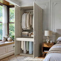 Beige armoire with pants rack and hanging rod