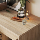 Wooden surface with a candle, small plant, and decorative items