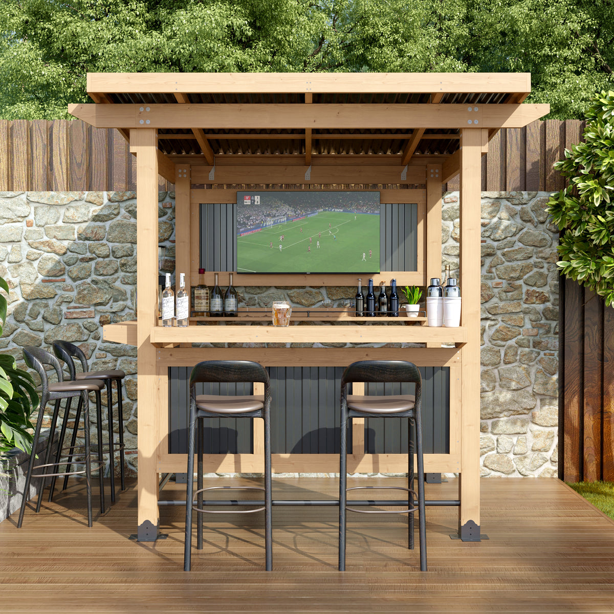 Outdoor bar setup with TV, stools, and drinks against a stone wall