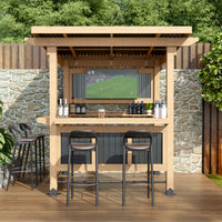 Outdoor bar setup with TV, stools, and drinks against a stone wall