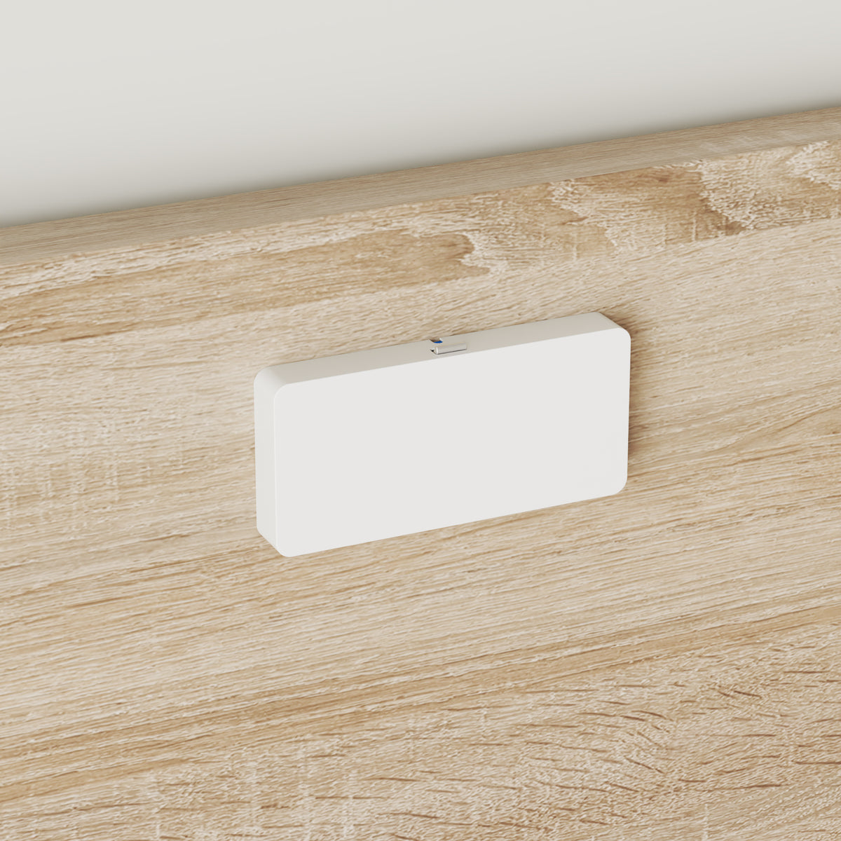 White rectangular object on a wooden surface