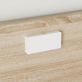 White rectangular object on a wooden surface