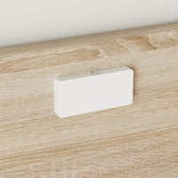 White rectangular object on a wooden surface
