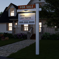 Real estate sign in front of a house