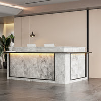 Modern reception desk with marble finish in an office setting