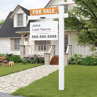 Real estate sign in front of a house