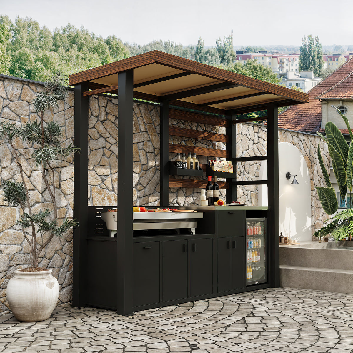 Outdoor kitchen with bar area and stone wall in a garden setting