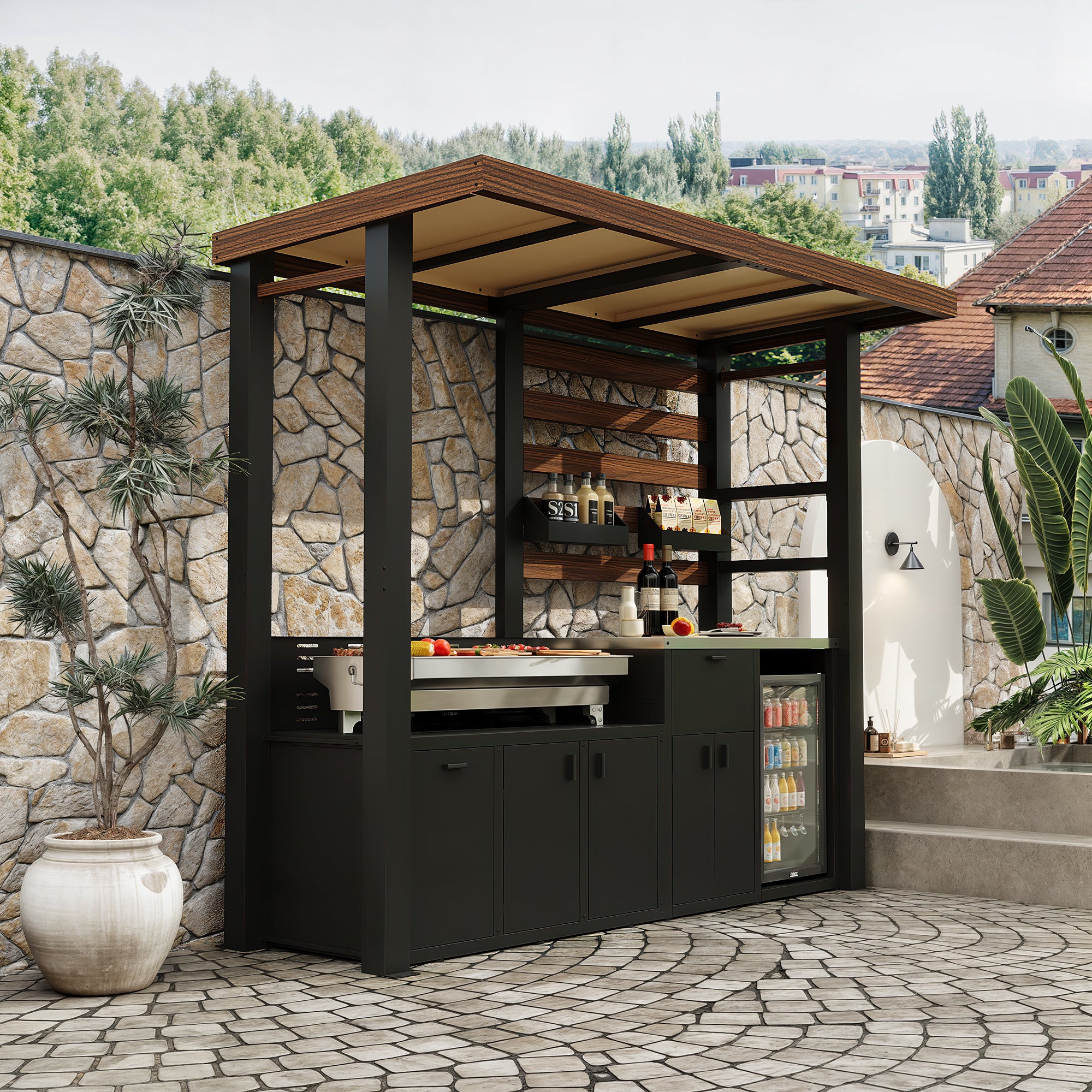Outdoor kitchen with bar area and stone wall in a garden setting