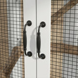 Black metal cabinet handles on a white door with a grid-patterned background
