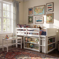 White kids loft bed with built-in desk, shelves, ladder, and storage space