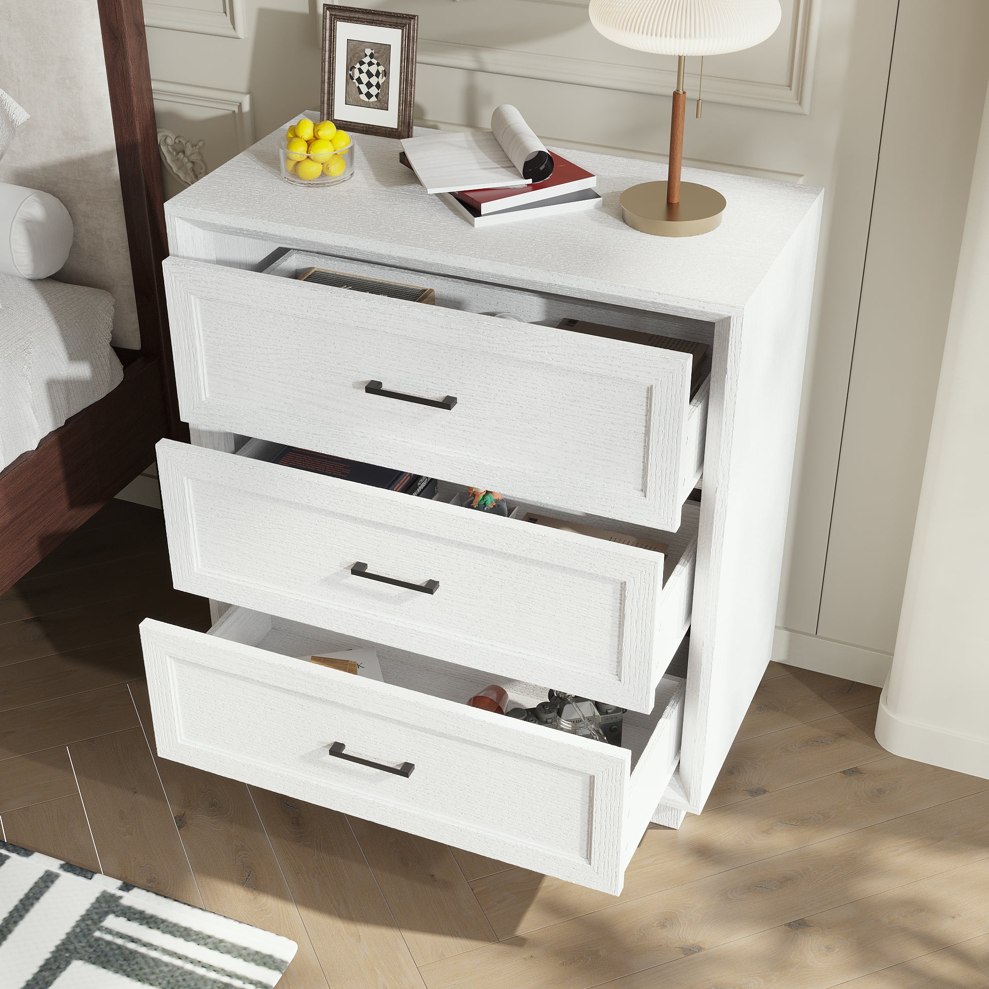 White 3-drawer nightstand with raised panel fronts and black handles