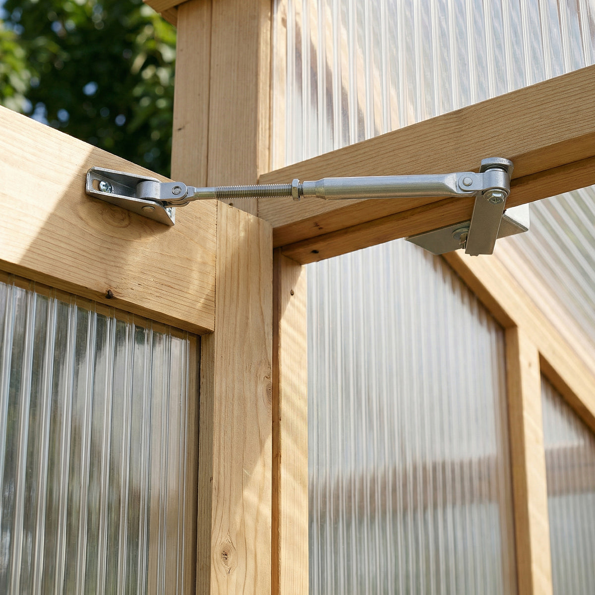 Metal bracket attached to a wooden structure with glass panels