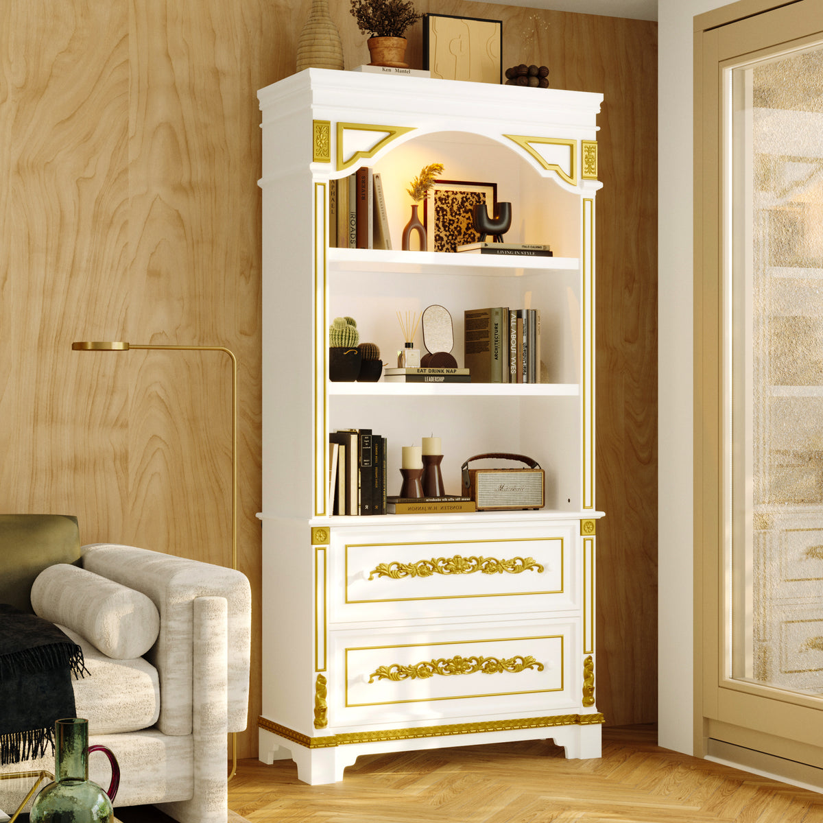 White bookshelf with gold accents in a room with wooden walls and a chair.