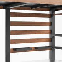 Wooden shelf with black brackets on a white background