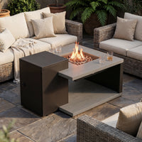 Outdoor patio setting with fire pit table and wicker chairs.