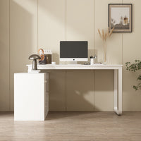 Modern home office with a white desk, computer monitor, and decor items.