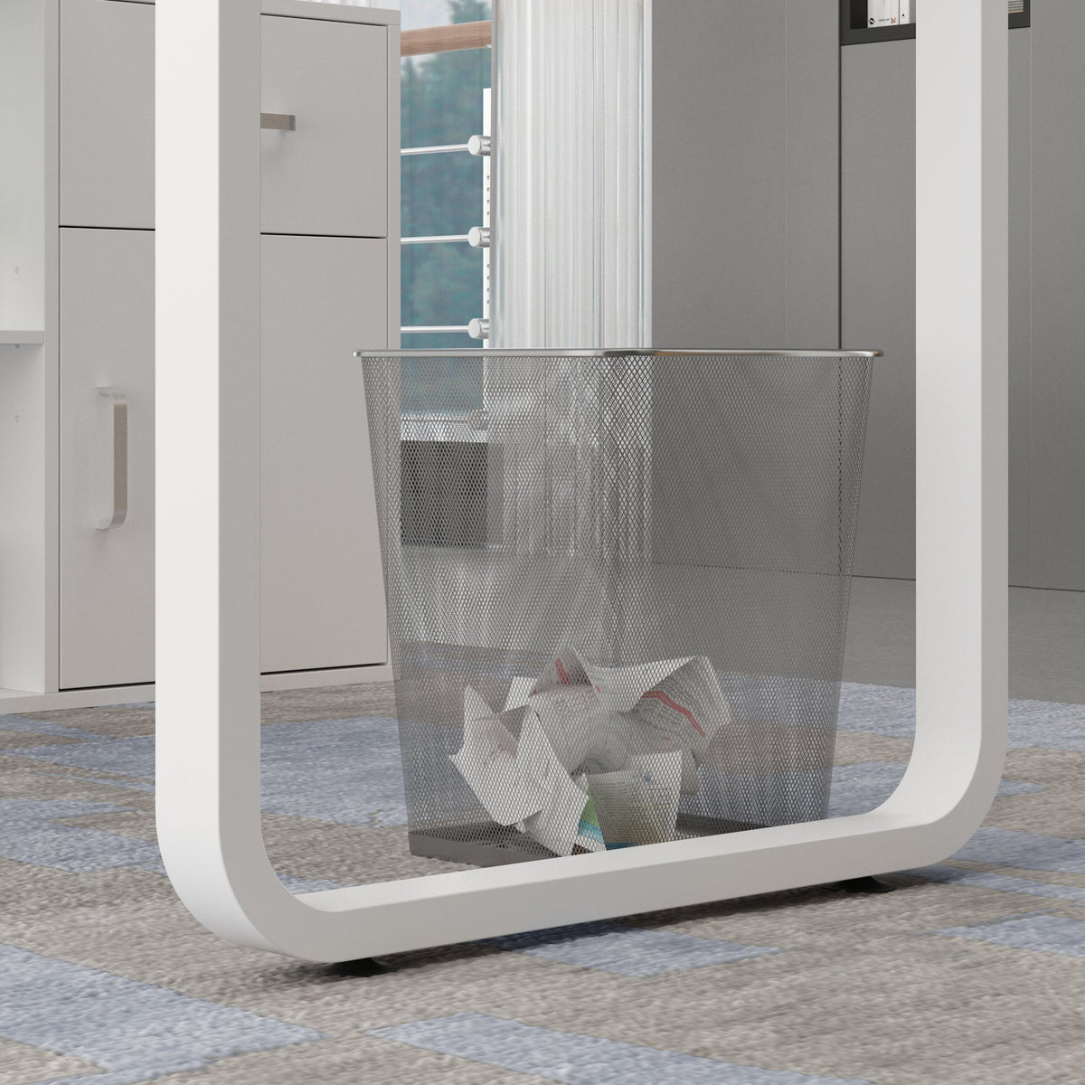 Modern trash can with a white frame and mesh design on a patterned floor.