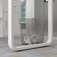 Modern trash can with a white frame and mesh design on a patterned floor.