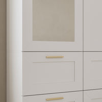 White armoire with mirror door, top cabinets, and lower drawers
