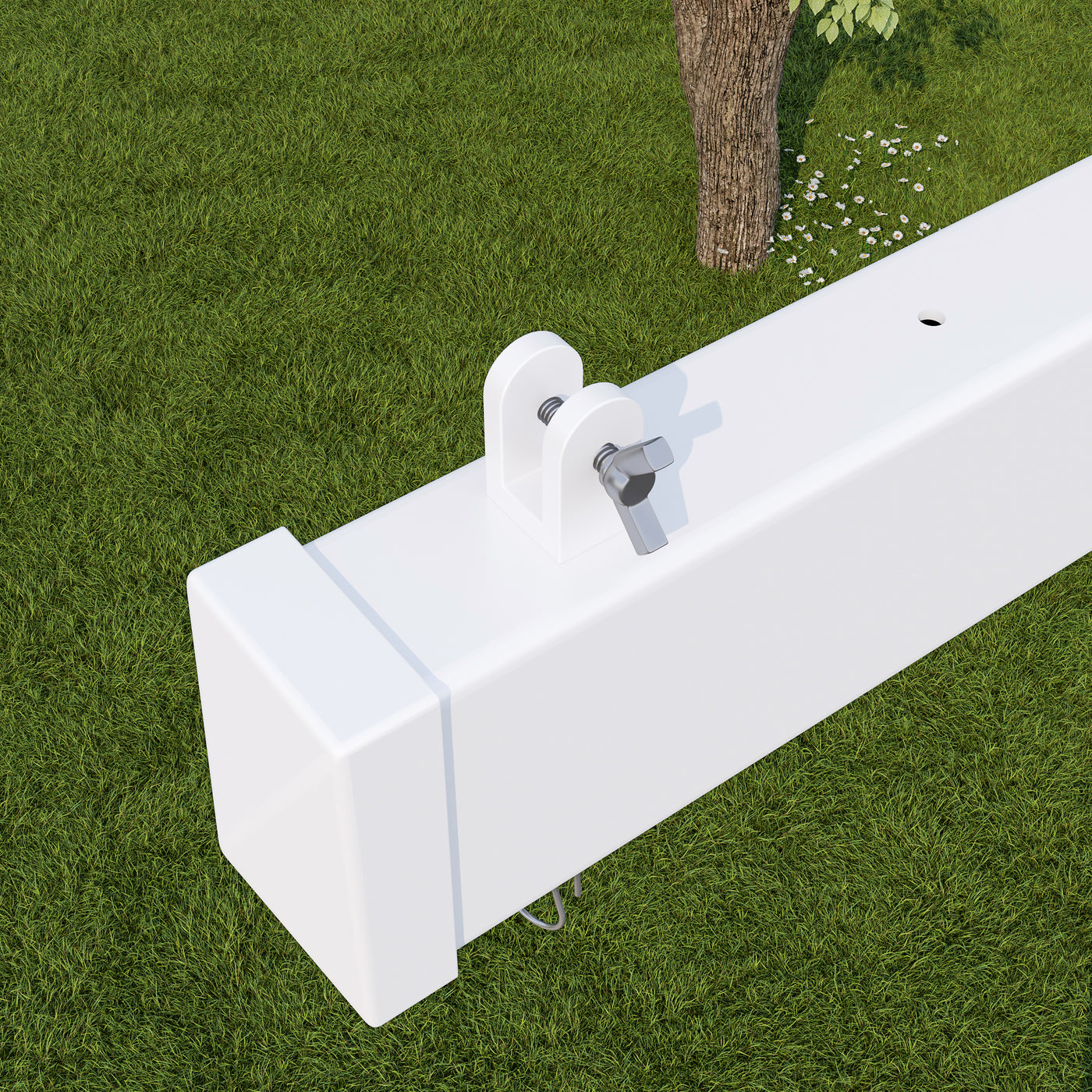 White metal bracket on a green grass background