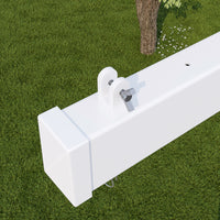 White metal bracket on a green grass background