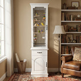 White birdcage with birds inside in a room with a bookshelf and chair.