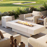 Outdoor patio setting with fire pit table and chairs near a golf course
