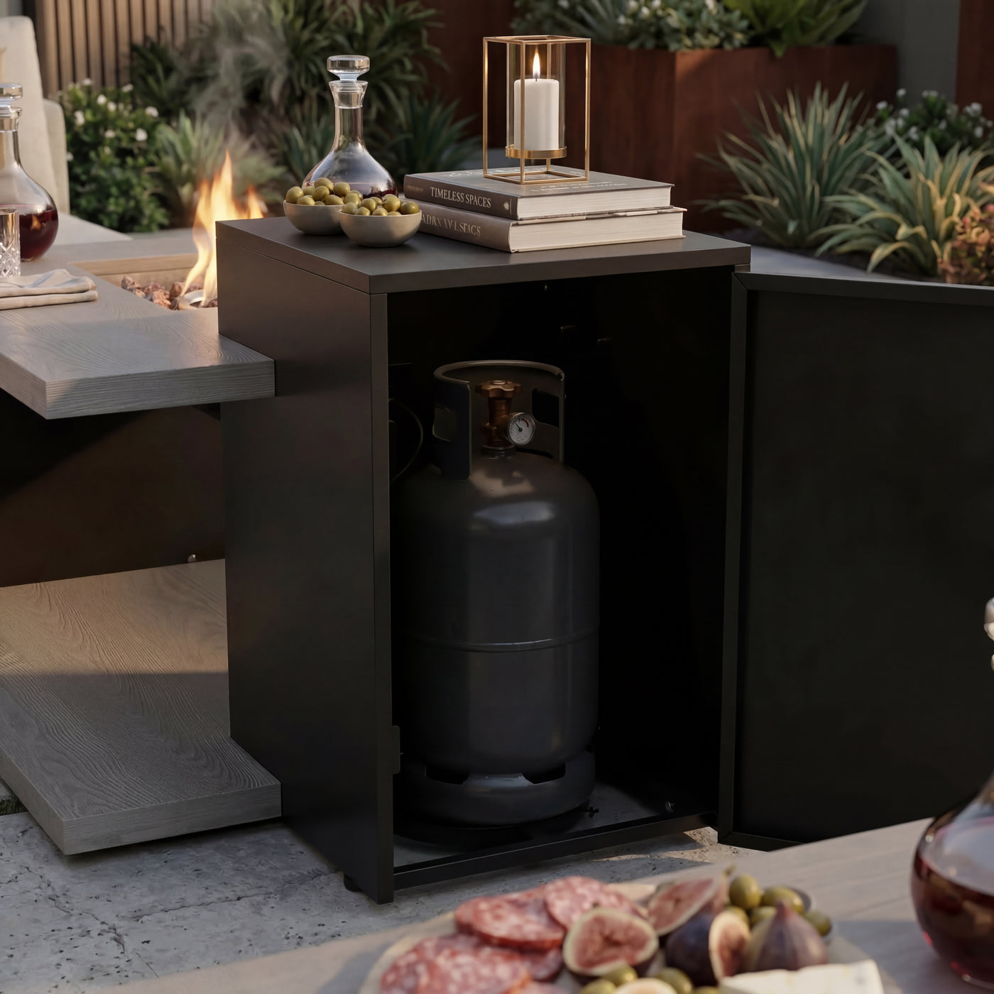 Outdoor setting with a propane tank inside a cabinet next to a fire pit and food platter.
