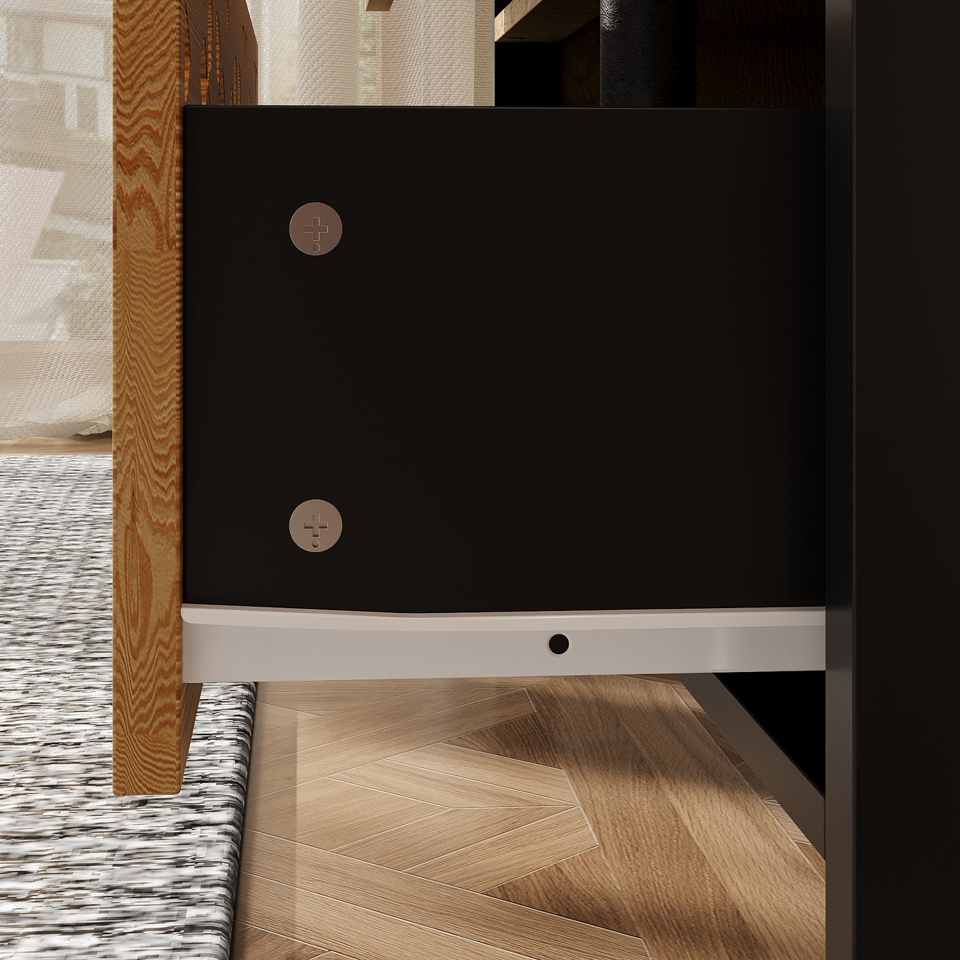 Black electronic device with wooden frame on a wooden floor